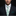 Man wearing white and green lucky tie and green square on suit