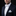 Man wearing a navy suit with a white bow tie and pocket square on a black background