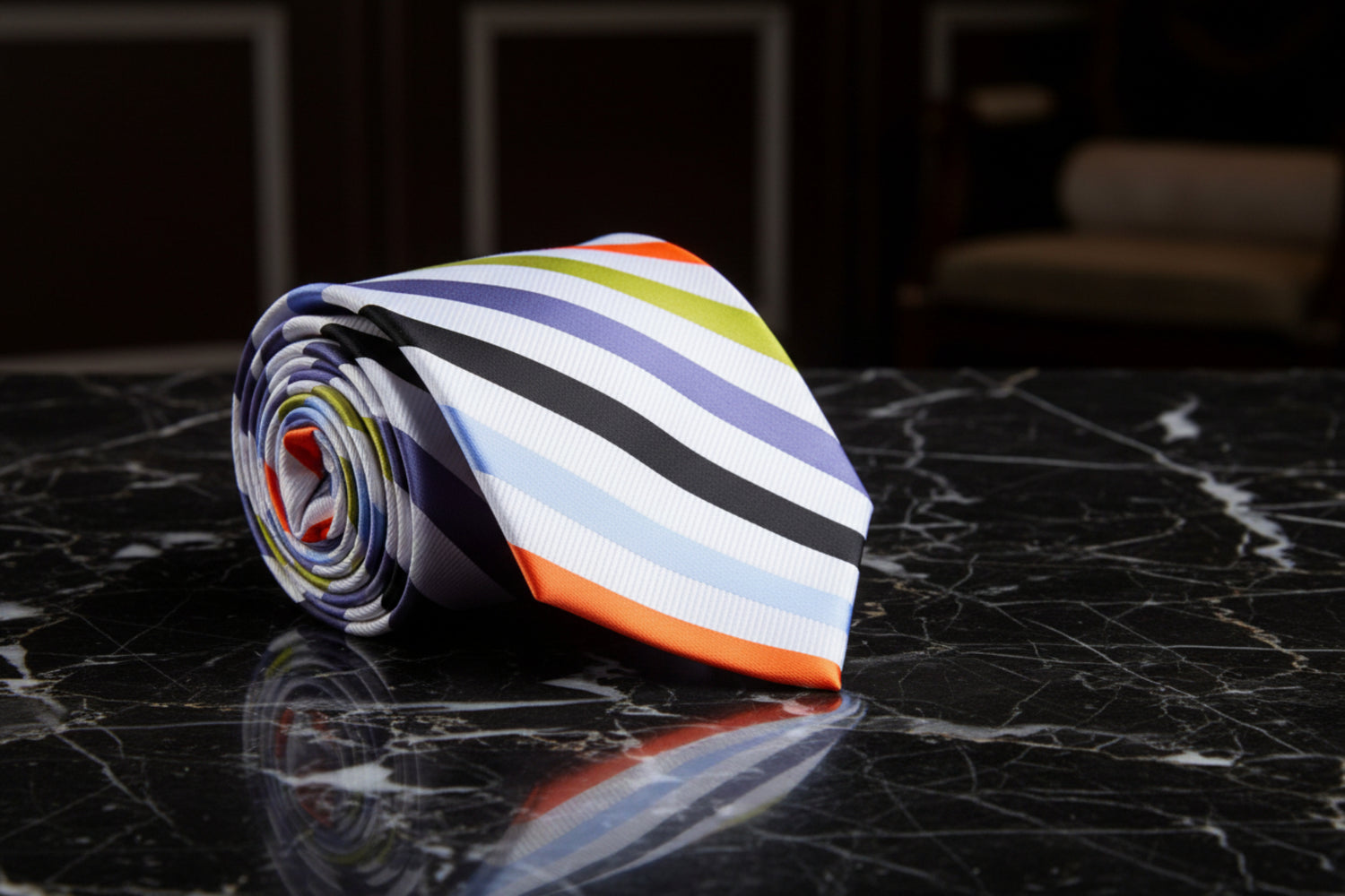 Colorful striped tie on a marble background