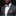 Man wearing a gray suit with a colorful bow tie and pocket square on a black background