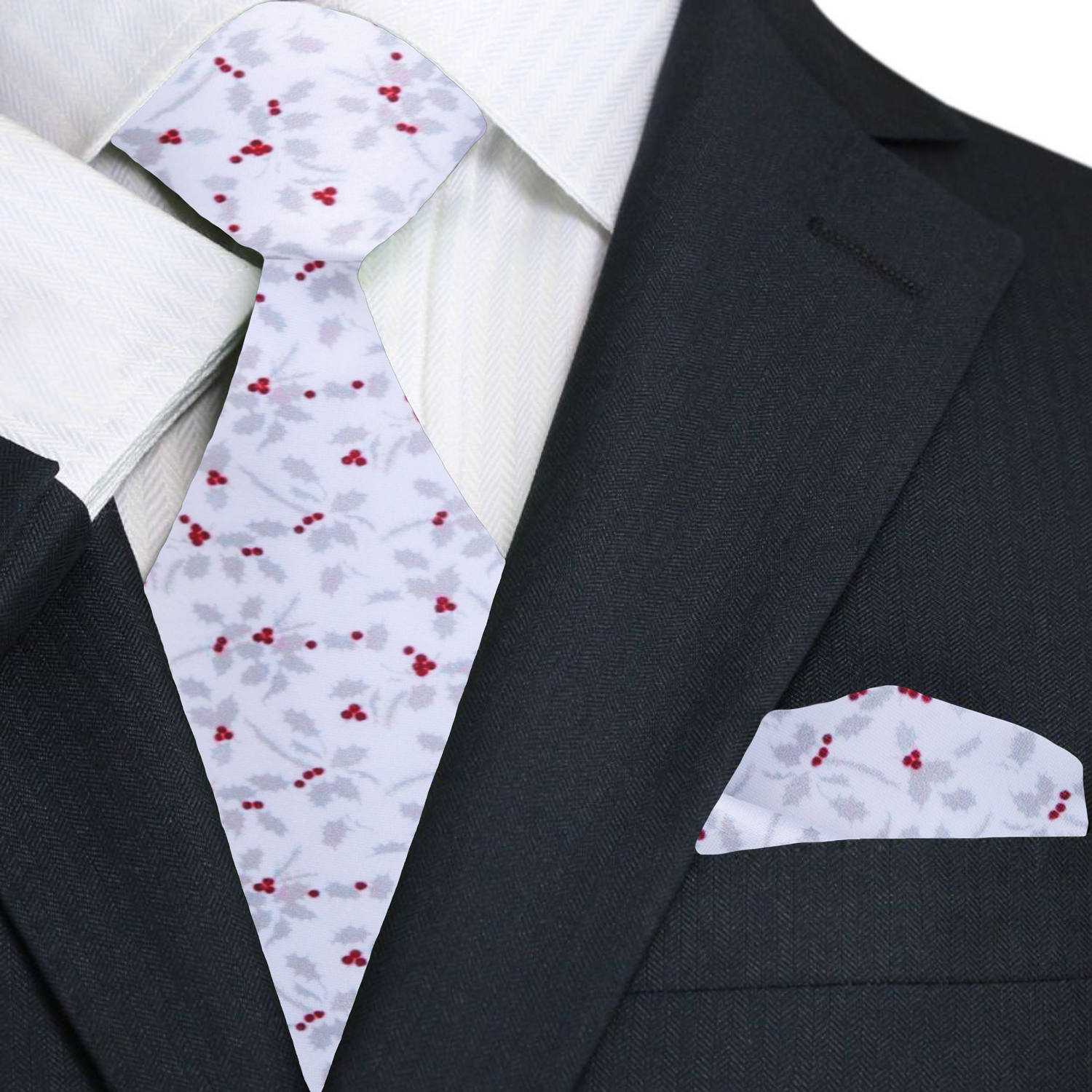 Black suit with white shirt, patterned tie, and matching pocket square.