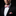 Man wearing a white, blue. orange and black stripe bow tie and square