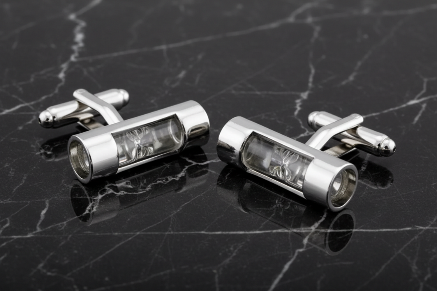A chrome and white colored hour glass shape cuff-links set||White Sand