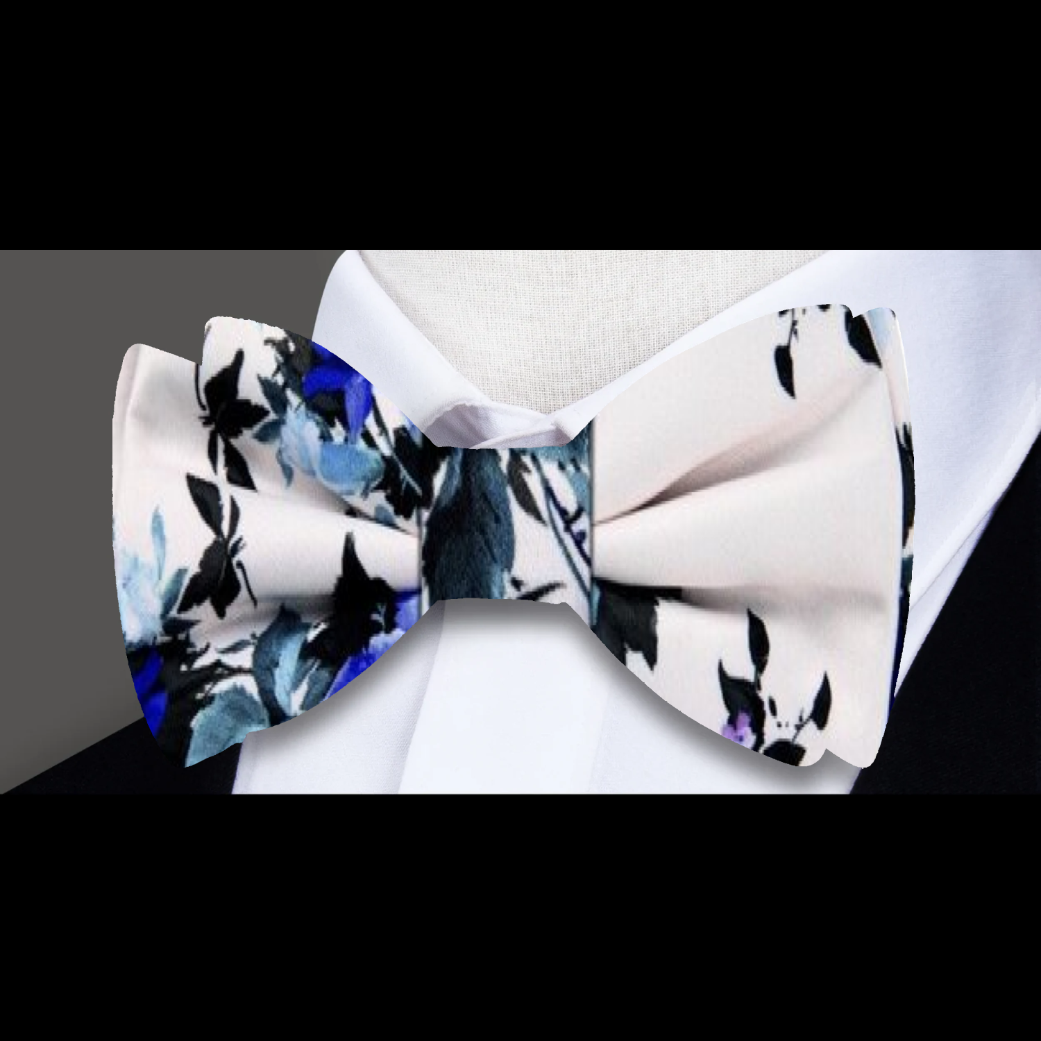 A Ivory, Blue, Purple Floral Pattern Silk Self Tie Bow Tie