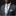 Man wearing a gray suit with a floral tie and pocket square against a black background