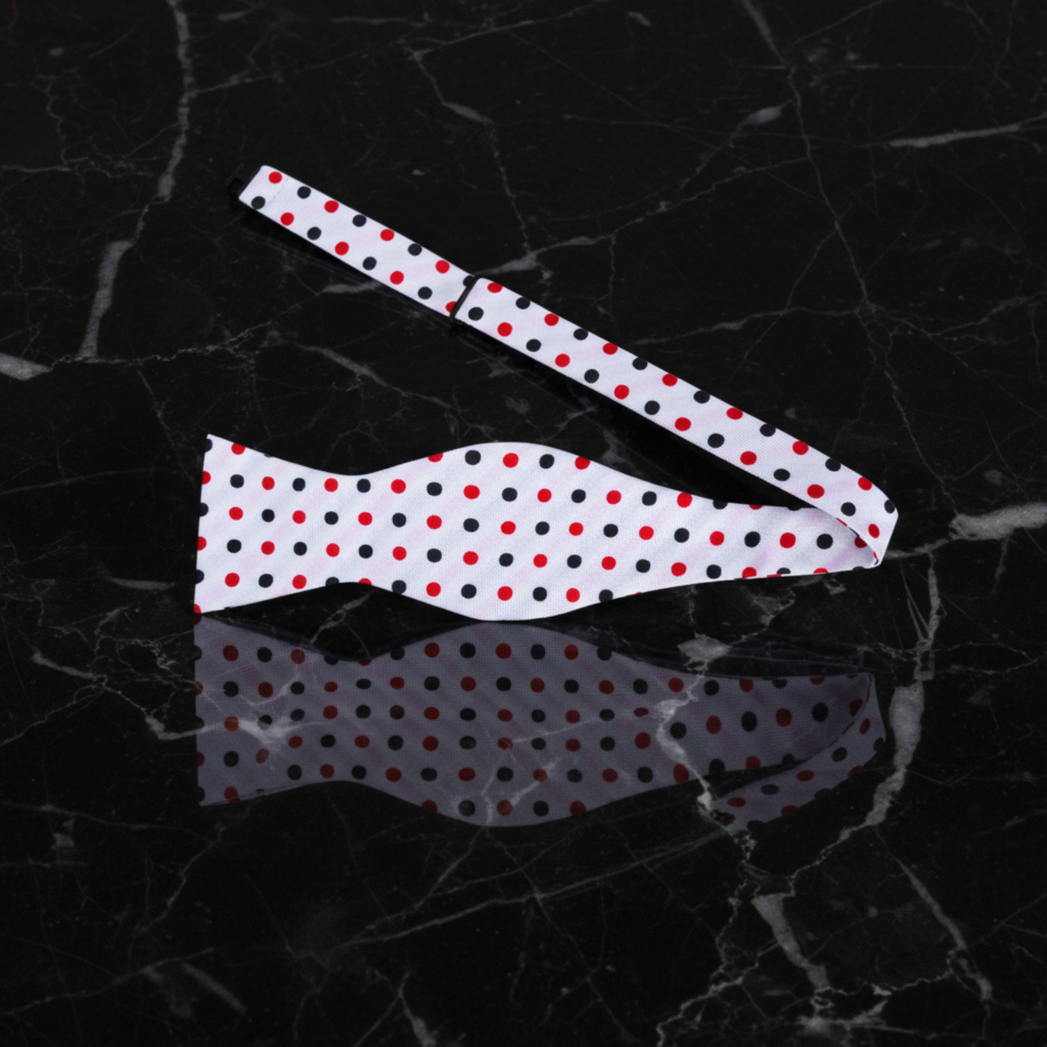 A set of polka dot patterned bow tie 