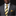 Man wearing a gray suit with a gold and black striped tie and matching pocket square on a black background
