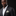 Man wearing a dark suit with a white shirt and patterned pocket square on a black background