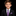 Boy wearing suit with purple tie and square