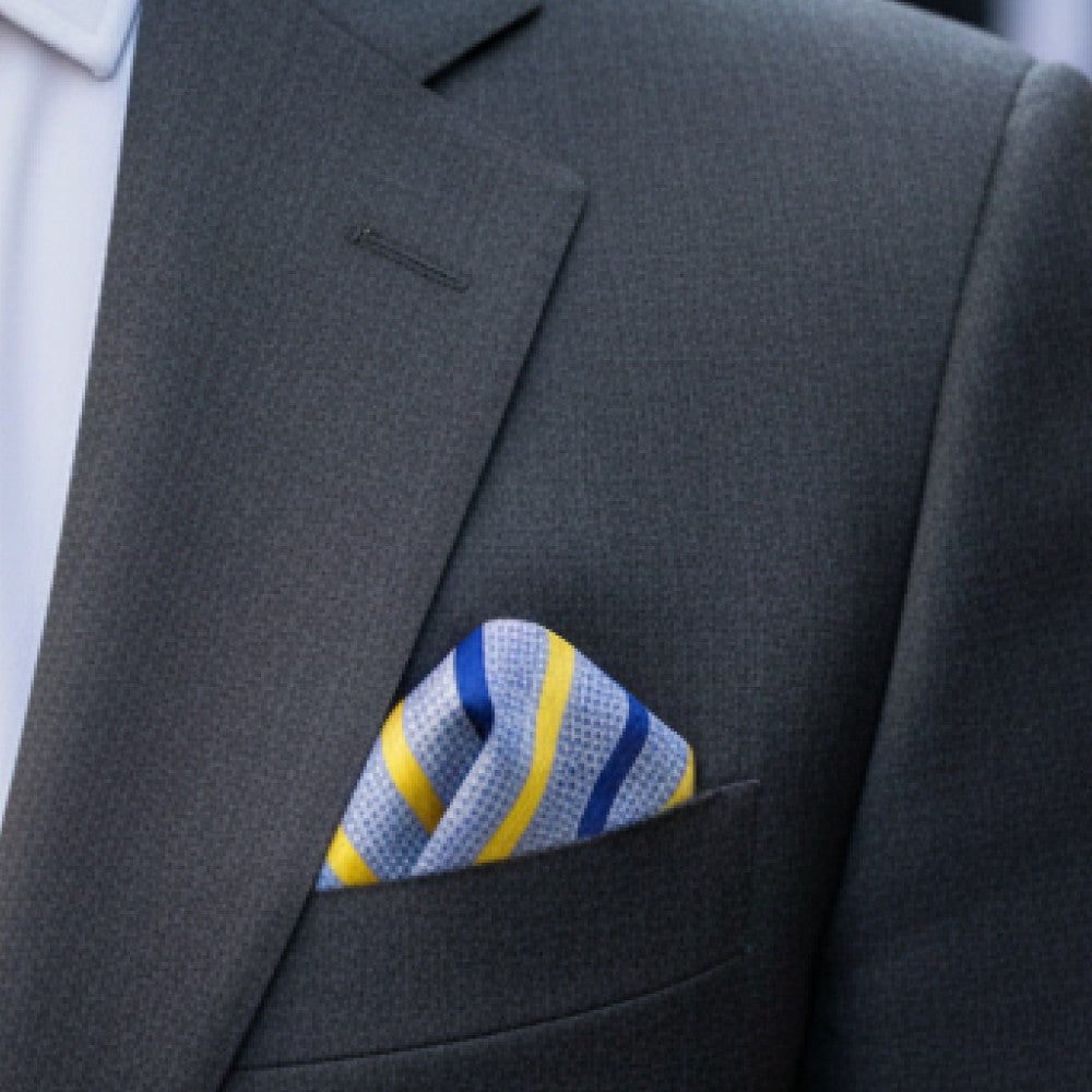 Gray suit jacket with a striped blue and yellow pocket square