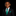 Young boy in a black suit with a green tie on a black background
