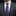 Man wearing a gray suit with a blue floral tie and pocket square.