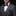 Man wearing a black suit with a purple bow tie and pocket square on a gray background