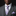 Man wearing a gray suit with a purple tie and pocket square on a black background