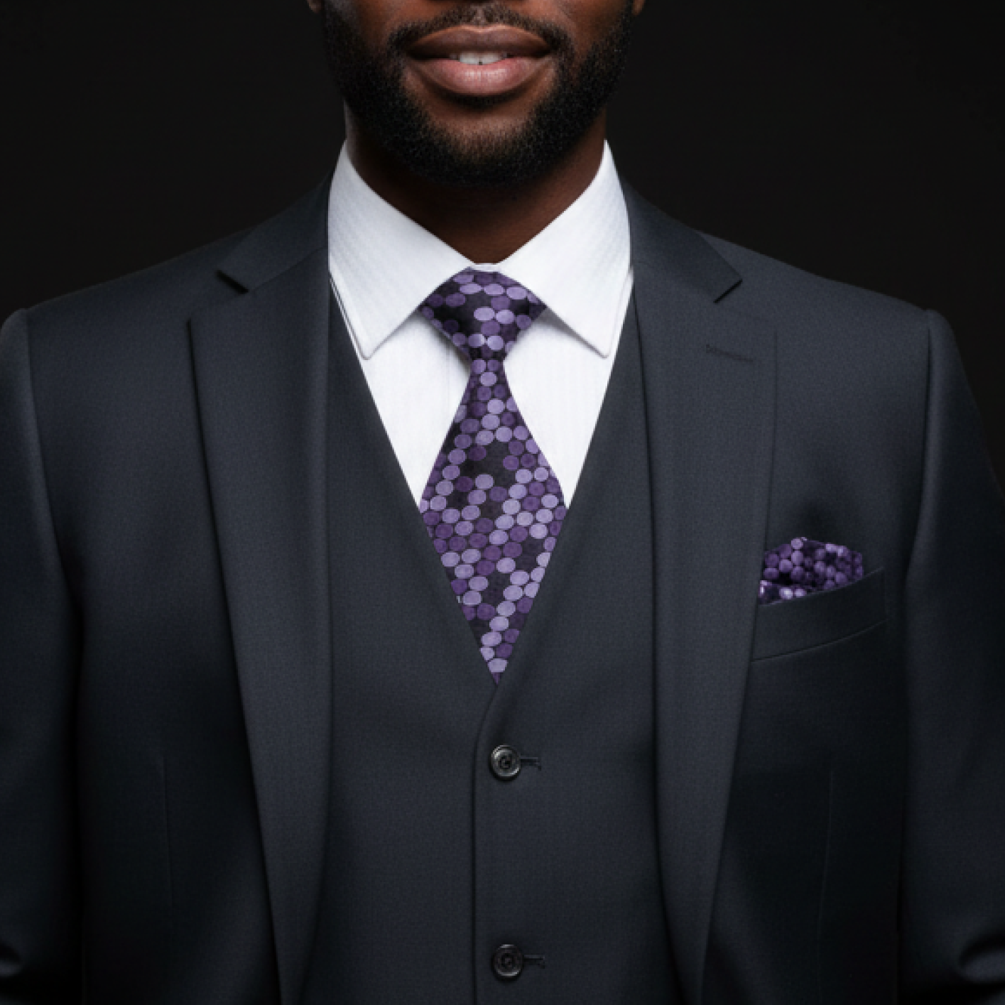 purple polka patterned tie and matching Square on man