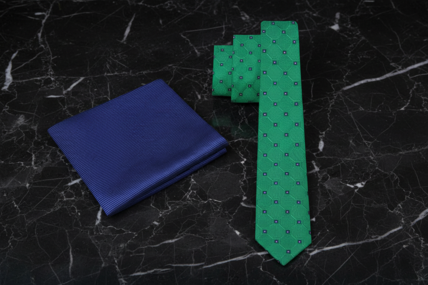 Blue pocket square and green tie with pattern 