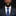 Man wearing a dark suit with a blue tie and pocket square on a black background