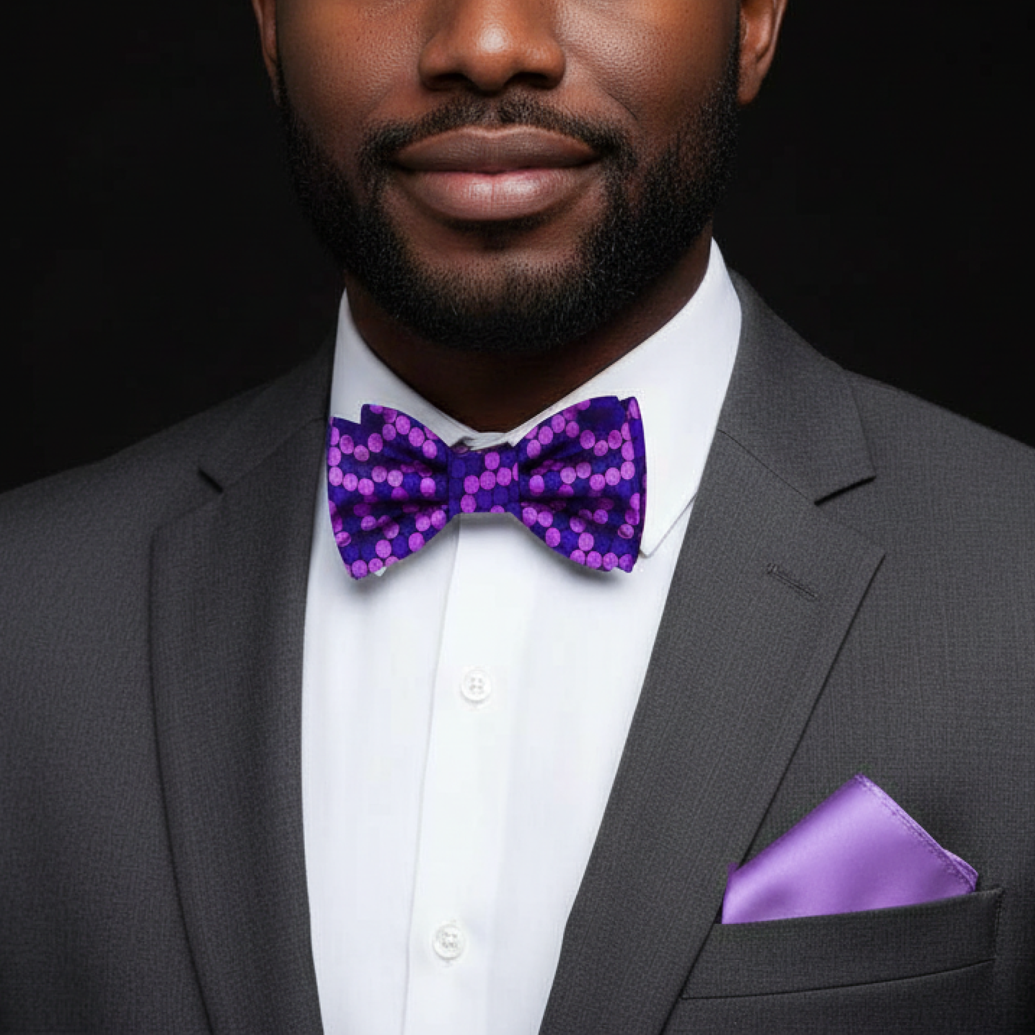 Man wearing purple dots bow tie and light purple square