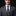Man wearing a gray suit with a colorful tie and pocket square on a black background