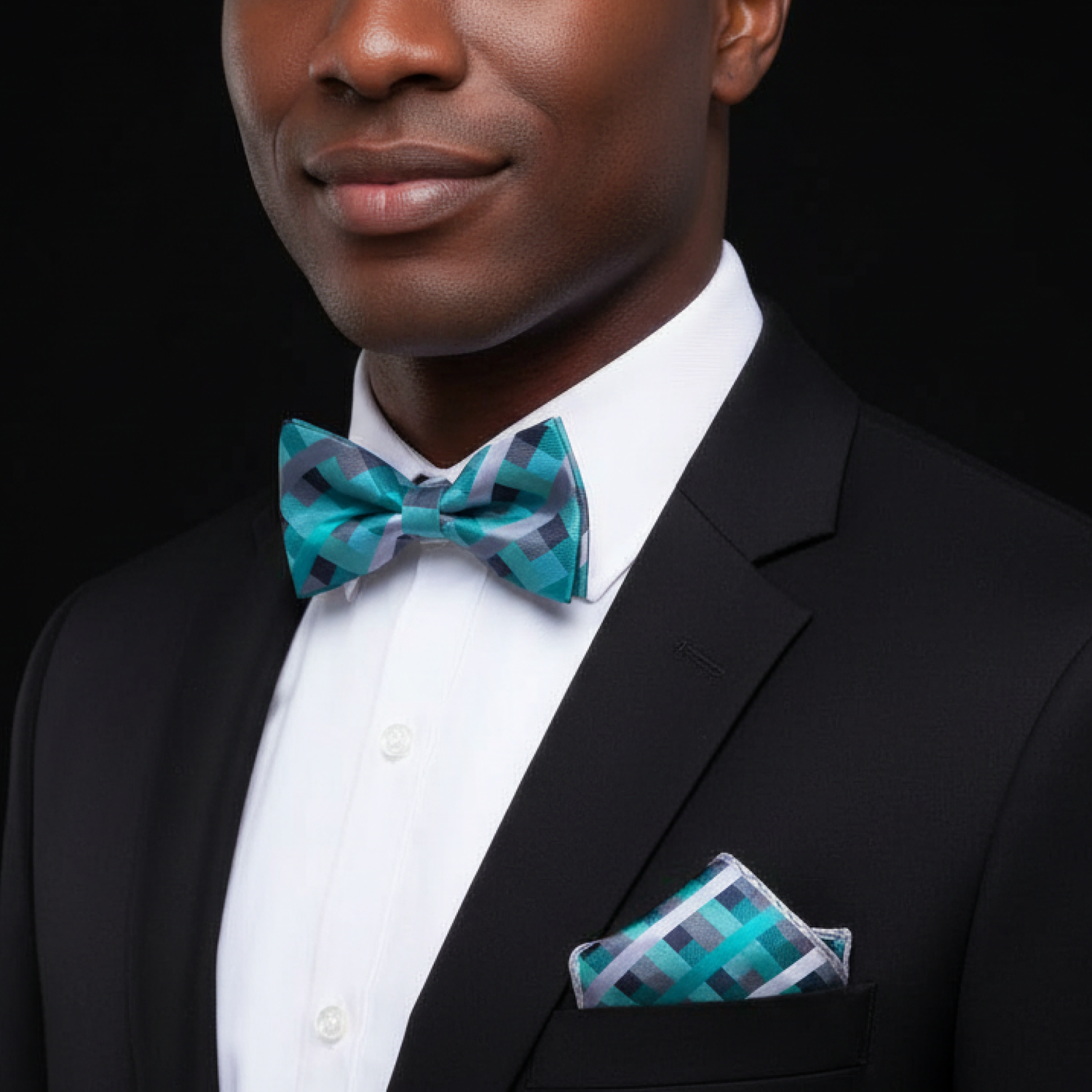 Man wearing light blue and grey check bow tie and square