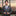Man in a gray suit with a cityscape background