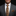 Man wearing a gray suit with a patterned tie and pocket square on a black background