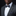 Man wearing a gray suit with a patterned bow tie and pocket square on a black background