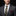Man wearing a gray suit with a patterned tie and pocket square on a black background