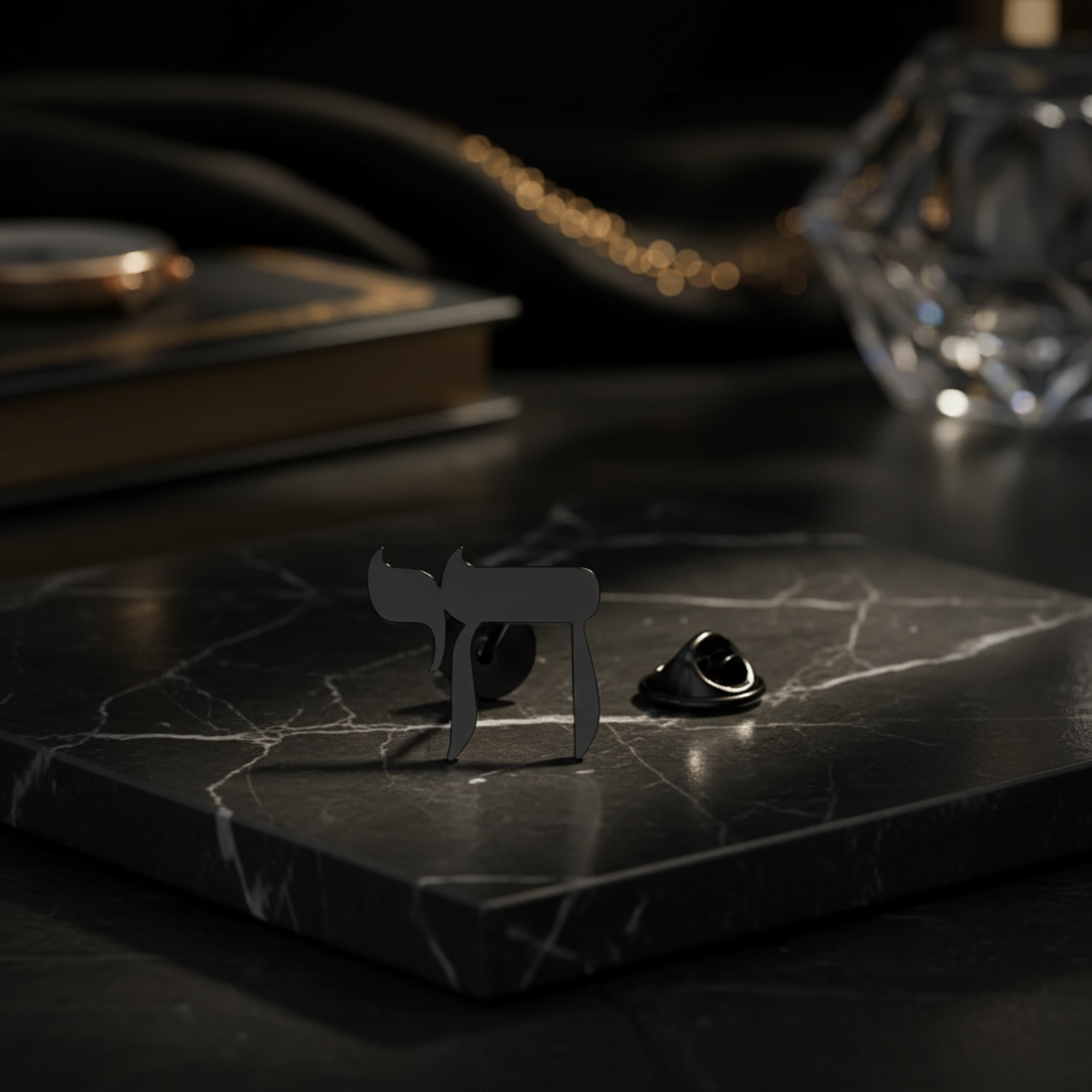 view 2 black lapel pin on marble