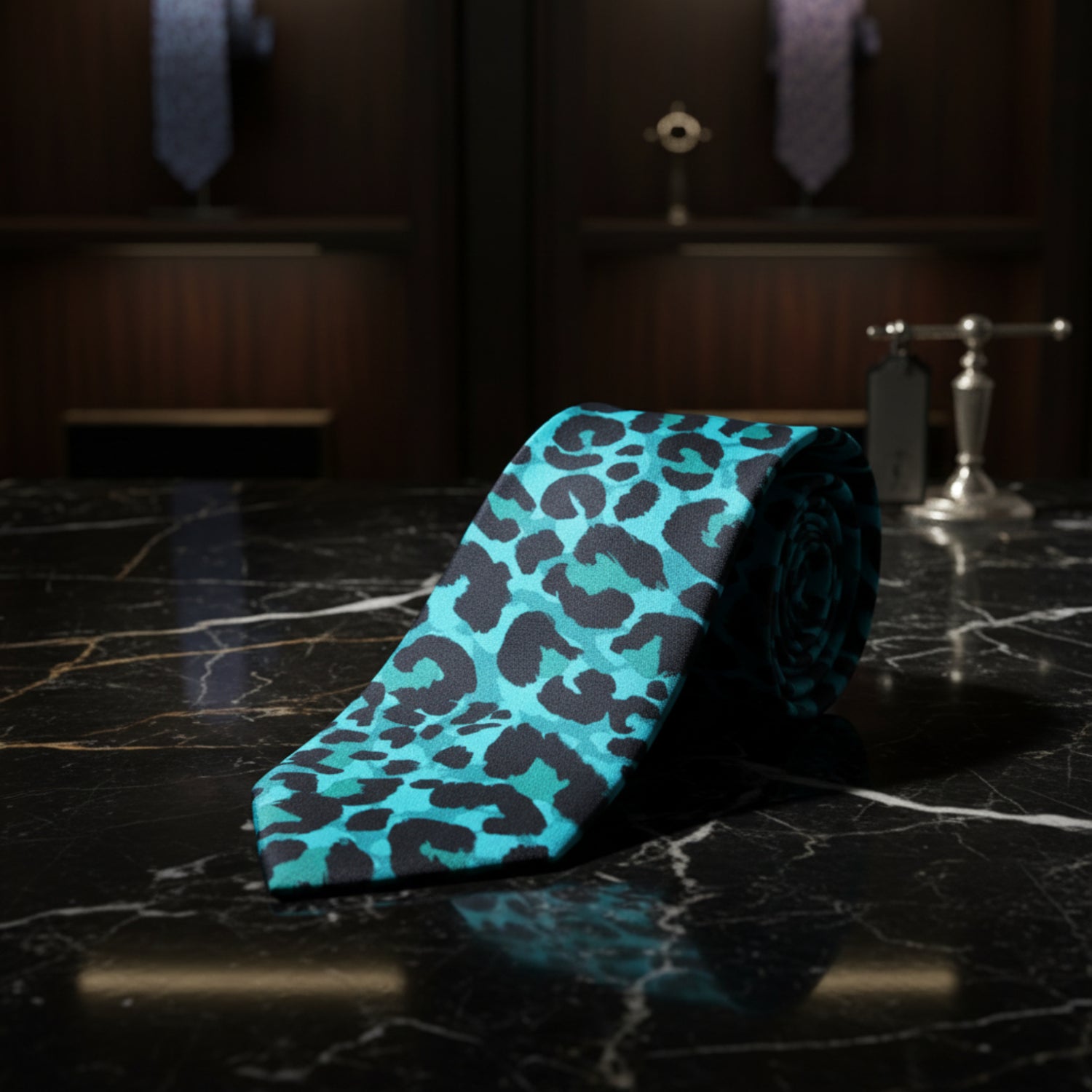 A necktie with a vibrant turquoise and black leopard print pattern, 