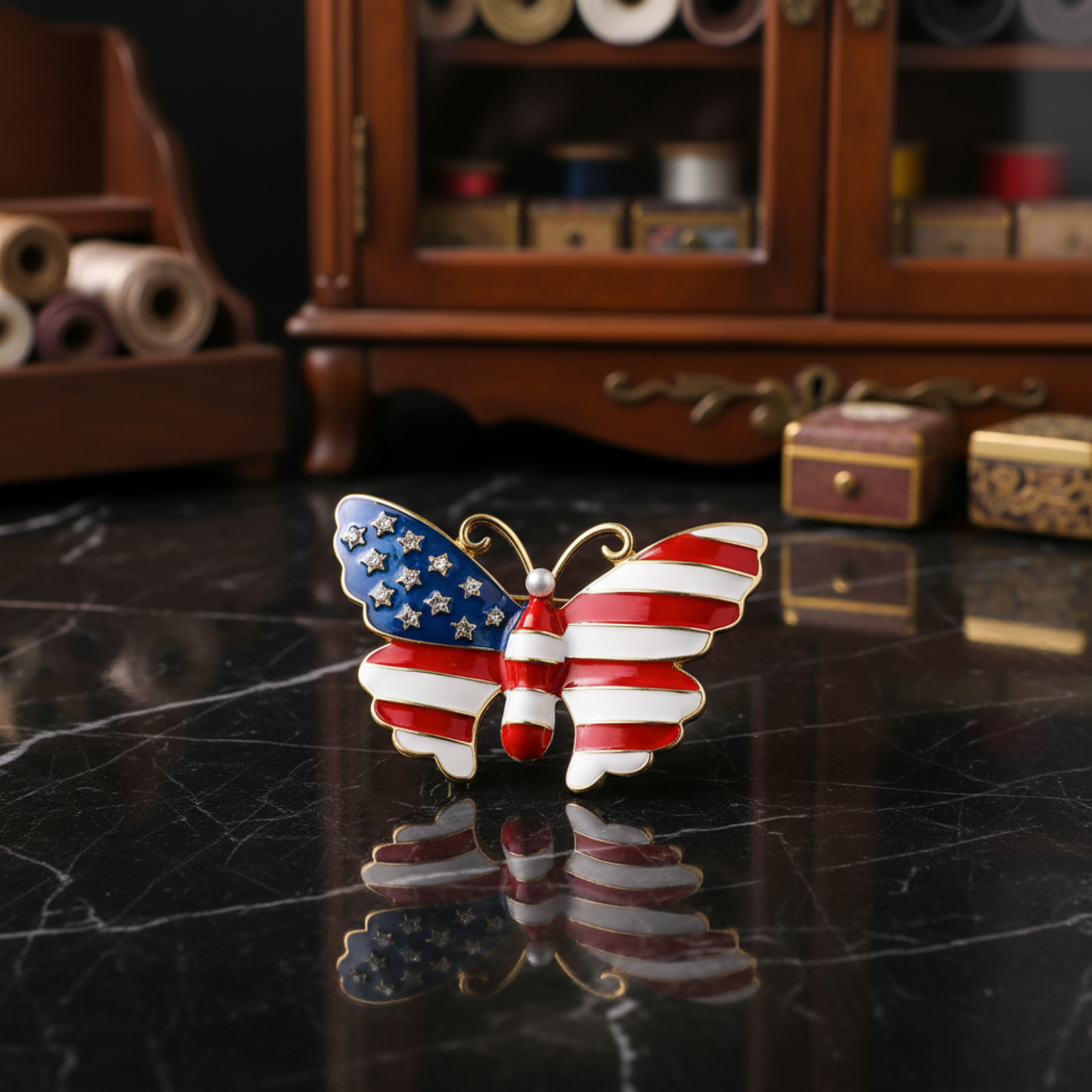 A butterfly-shaped brooch with an American flag design, featuring a blue wing with white stars, red and white stripes, and gold-tone outlines, shown with dimension labels and weight 34