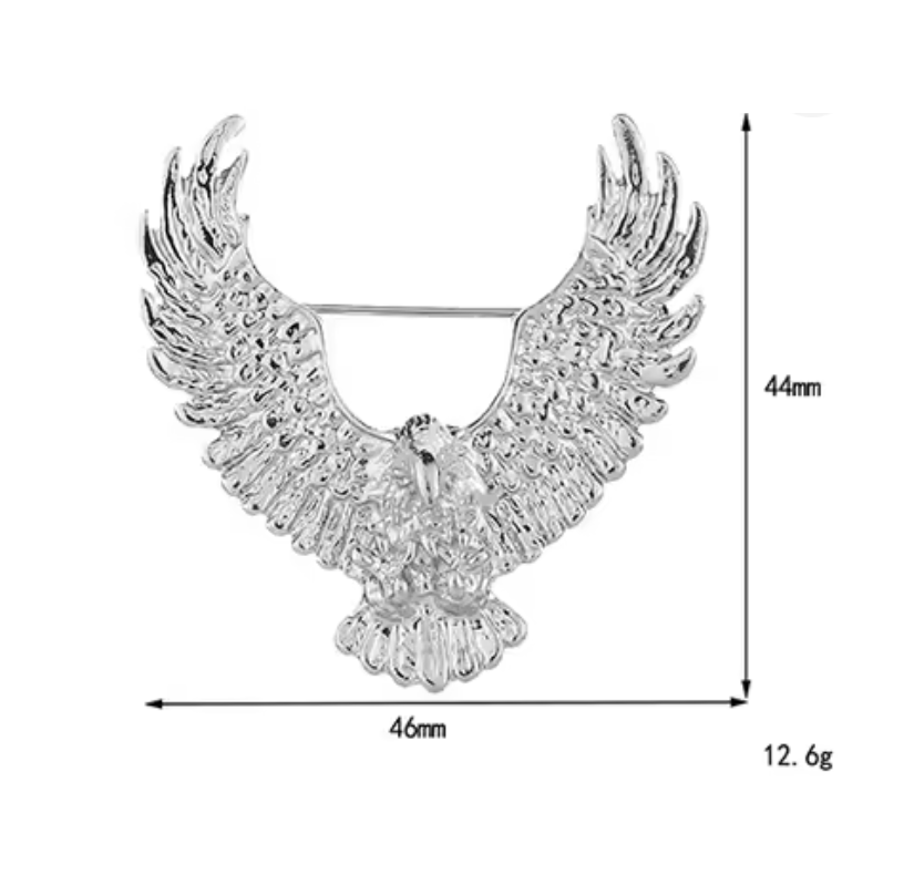 Silver eagle brooch with detailed wings and measurements on a white background