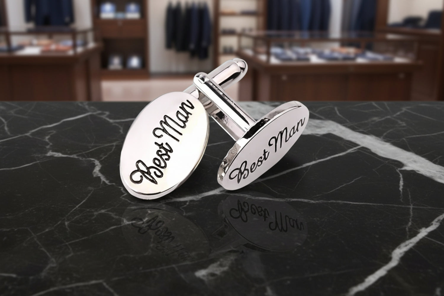 A Chrome and Black Color Oval Shaped Cuff-links set that says Best Man on each||Chrome, Black Best Man