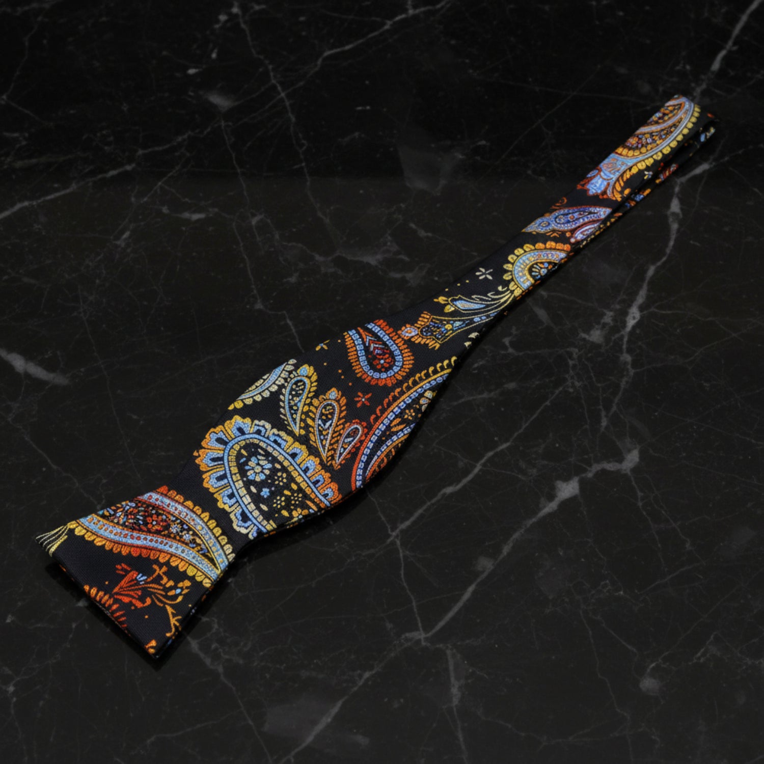 Self Tie: Black, Orange, Blue, Red, Yellow Paisley Bow Tie  