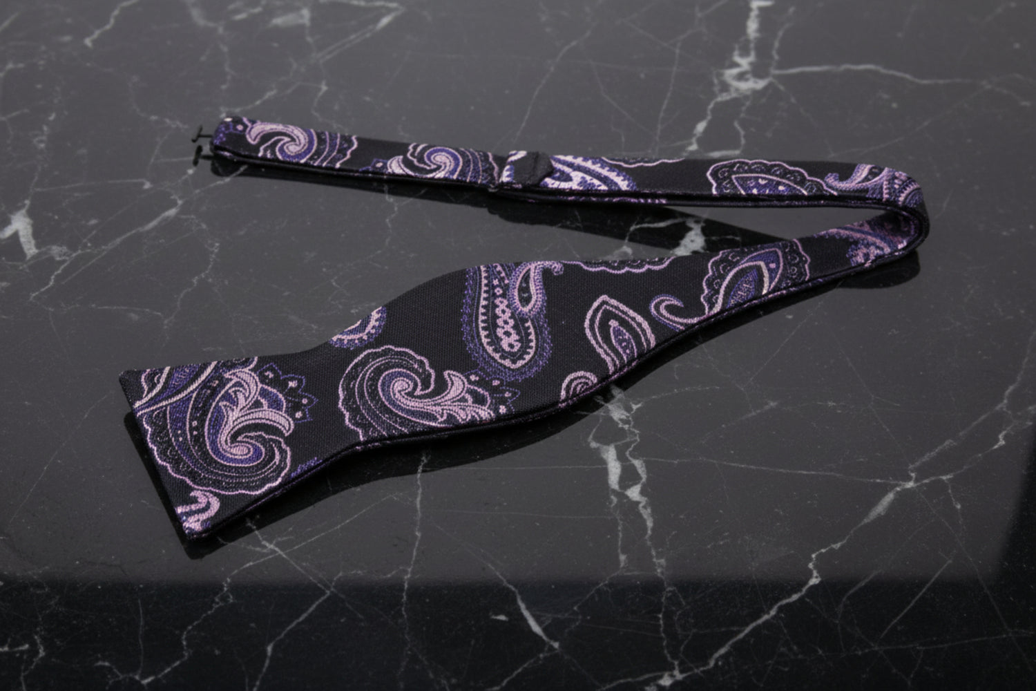 A Black, Pink Paisley Pattern Self Tie Bow Tie Untied