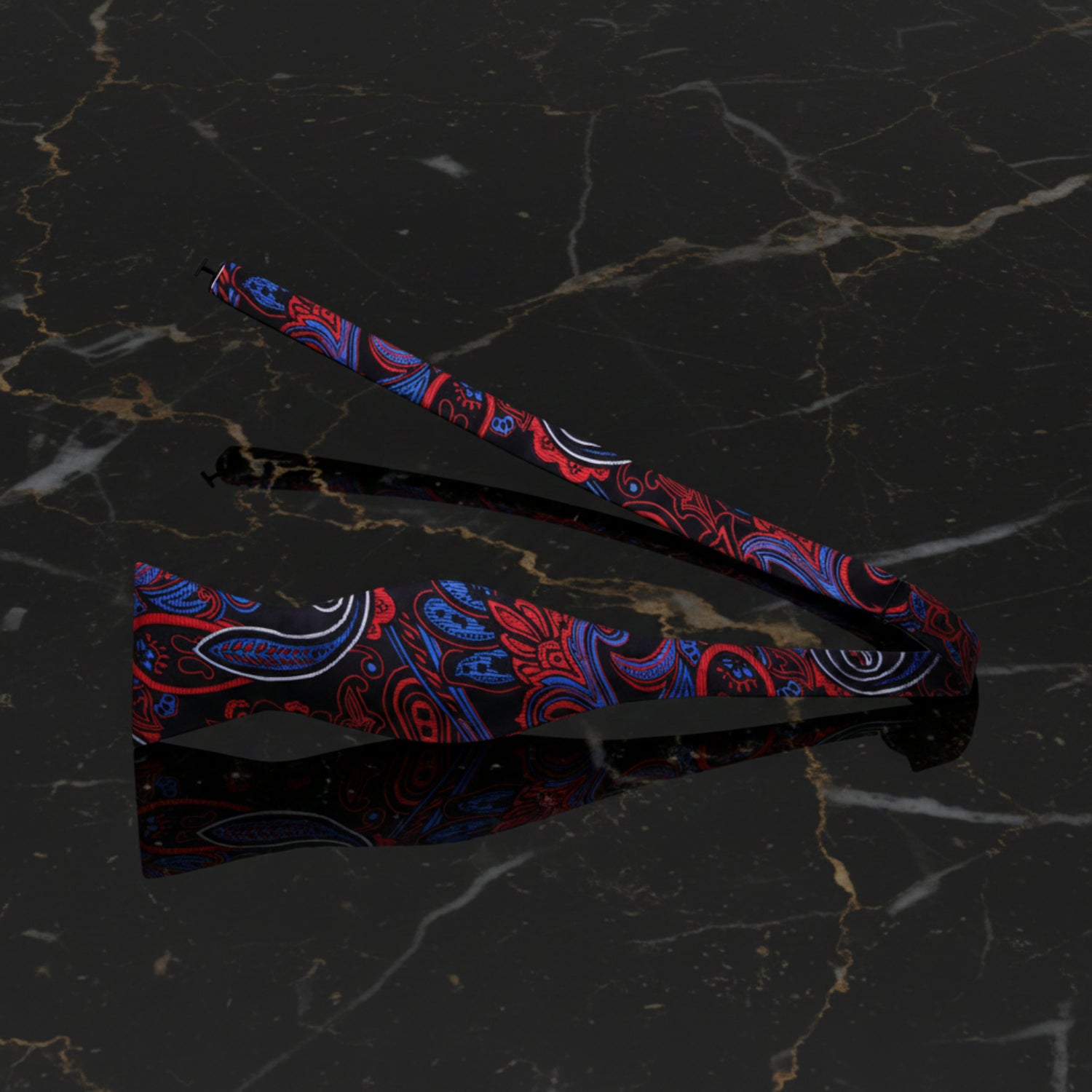 A Black, Red, Blue, White Paisley Pattern Self Tie Bow Tie Untied