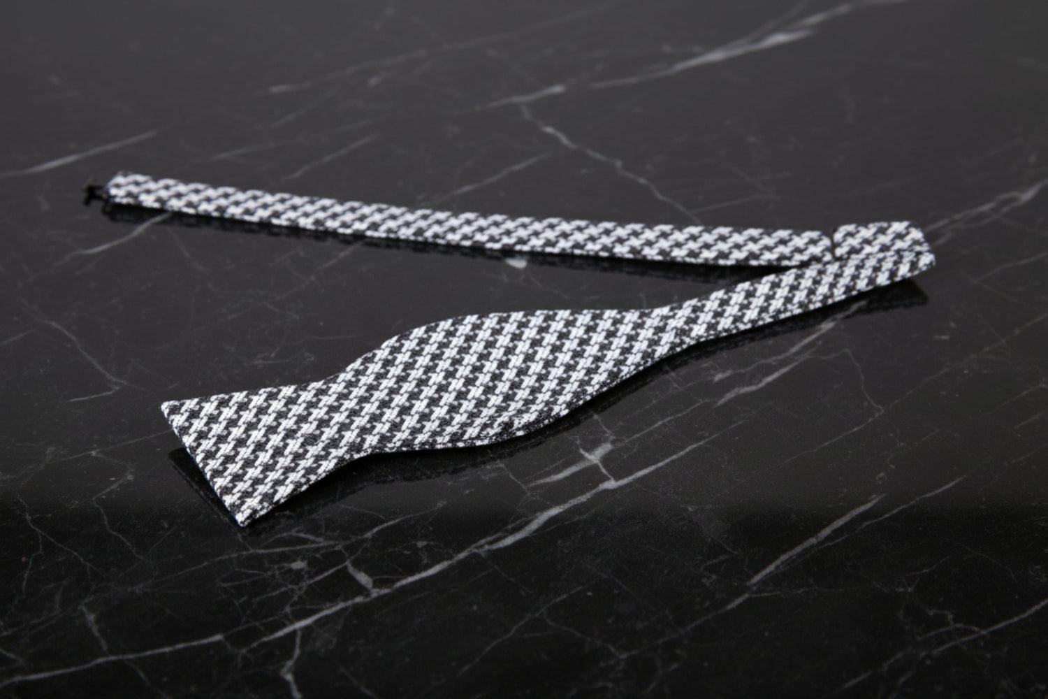 A Black, Grey Geometric Houndstooth Pattern Self Tie Bow Tie Untied