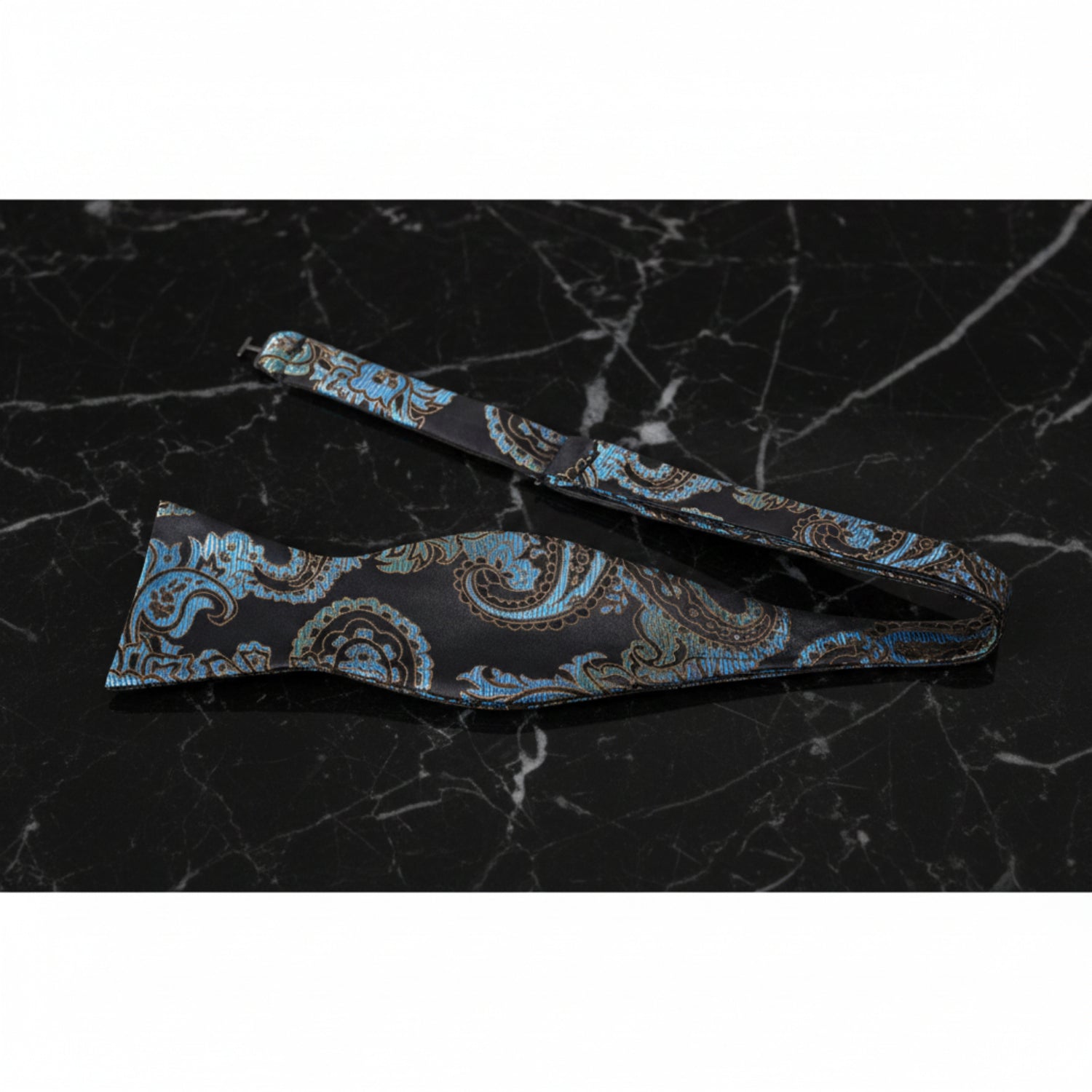 A Black, Teal Paisley Pattern Self Tie Bow Tie Untied