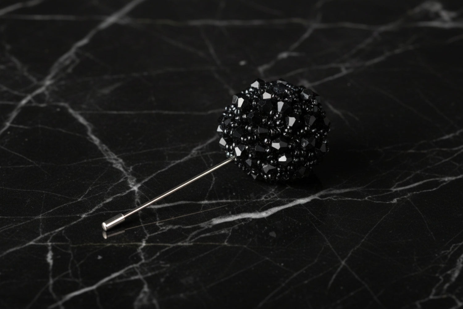 A Black Colored Stone Lapel Cushion||Black