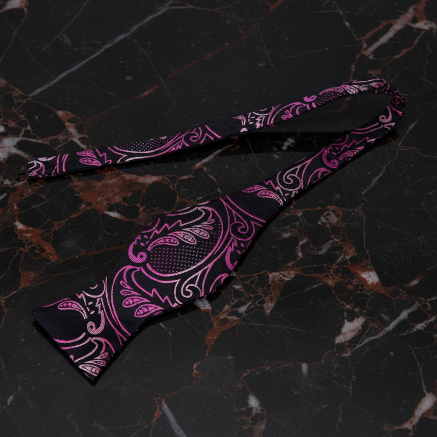 A Black, Pink Paisley Pattern Self Tie Bow Tie Untied