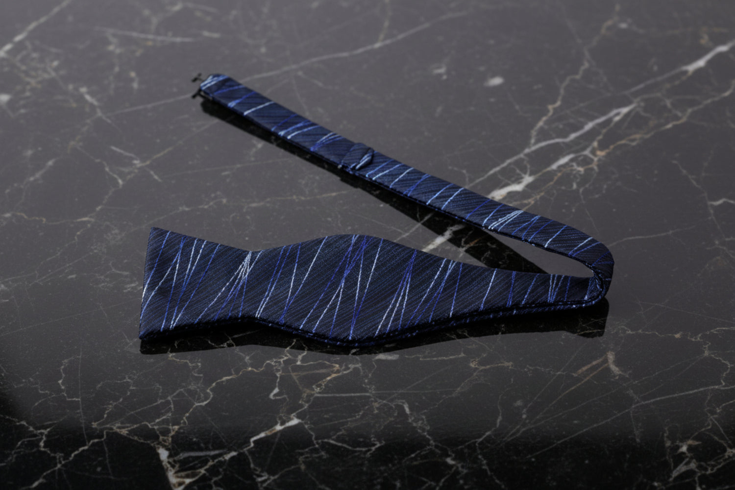 A Blue, Black 3D Intersecting Abstract Lines Pattern Self Tie Bow Tie Untied