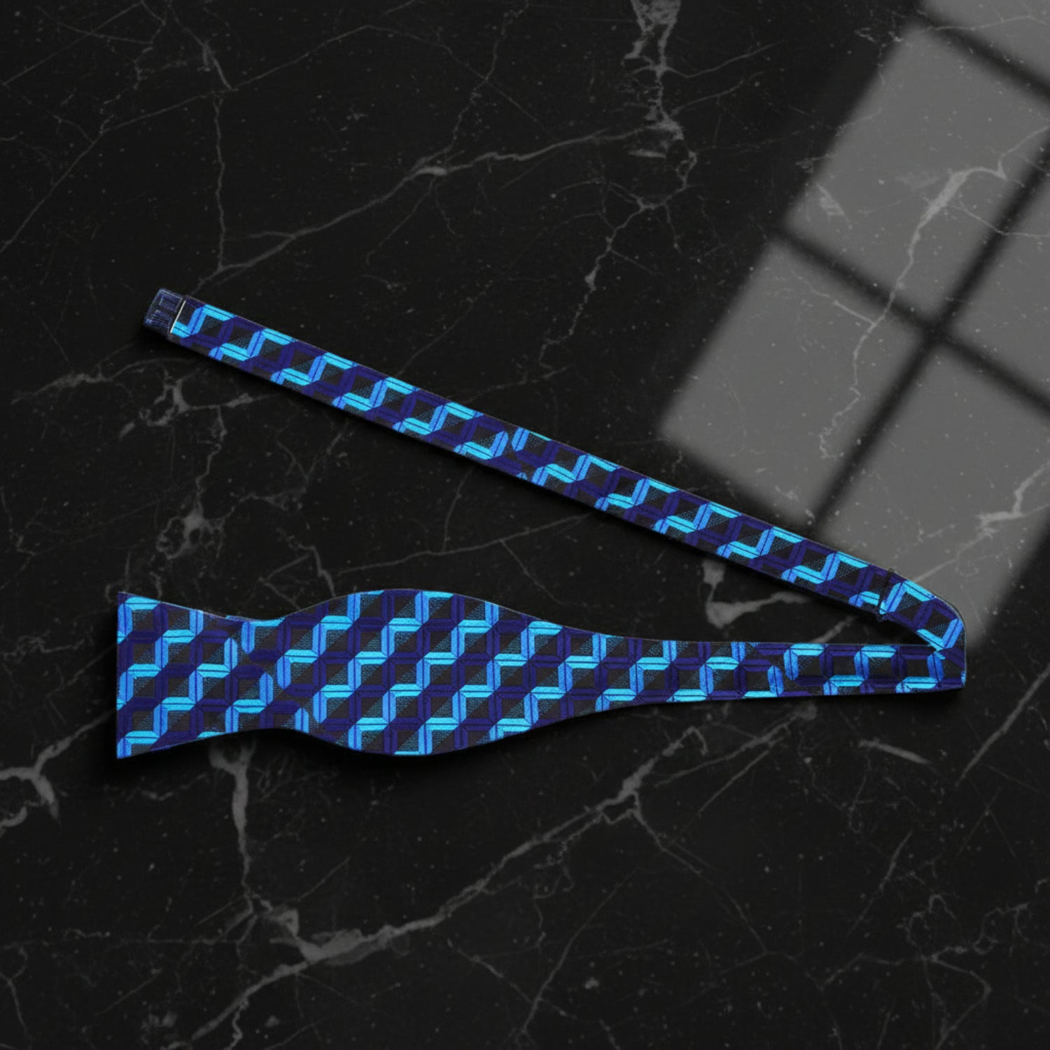 A Blue, Dark Blue Geometric Blocks Pattern Self Tie Bow Tie Untied