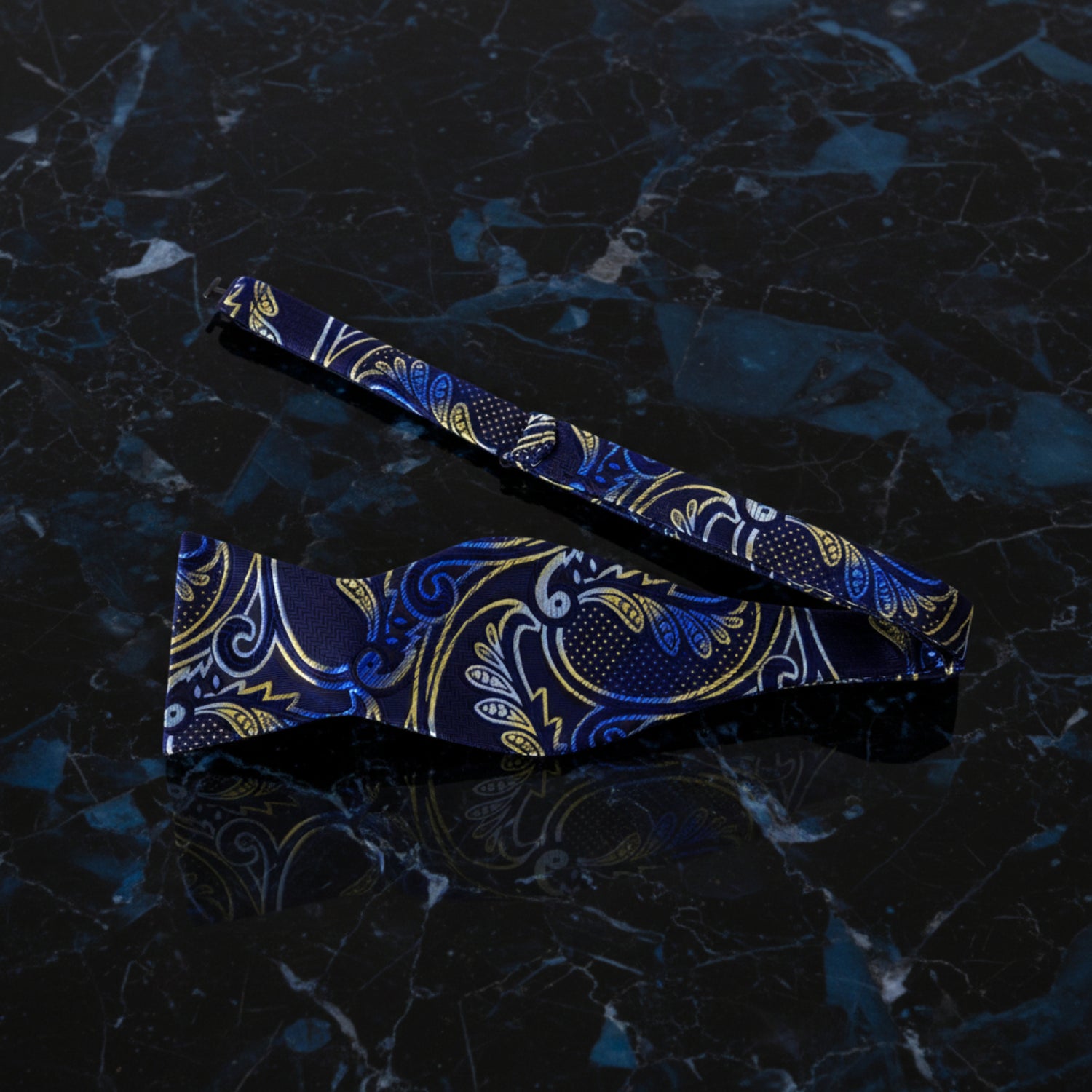 A Blue, Gold Paisley Pattern Self Tie Bow Tie Untied