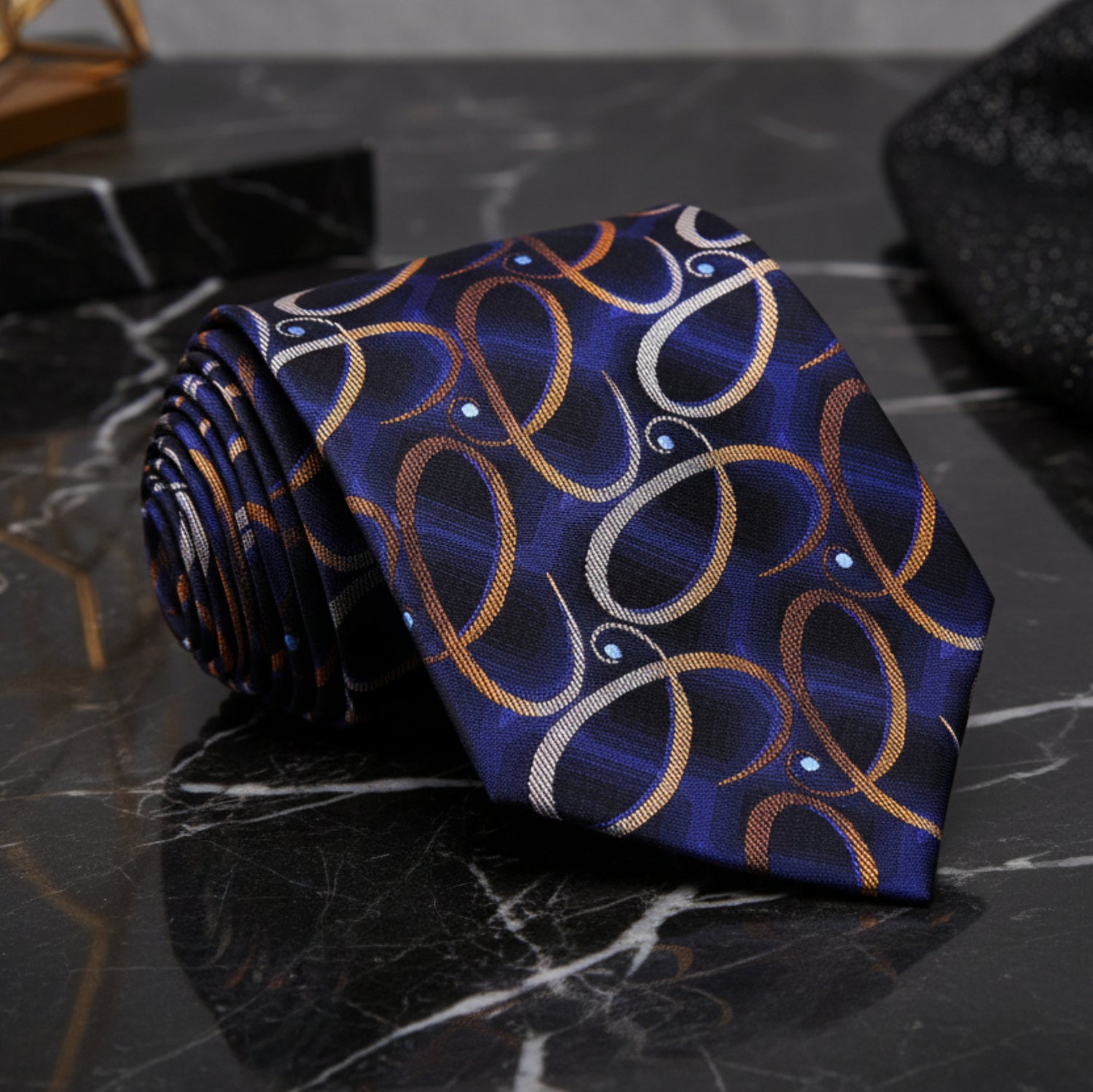 A Dark Blue, Gold, Looped Paisley Pattern Necktie 