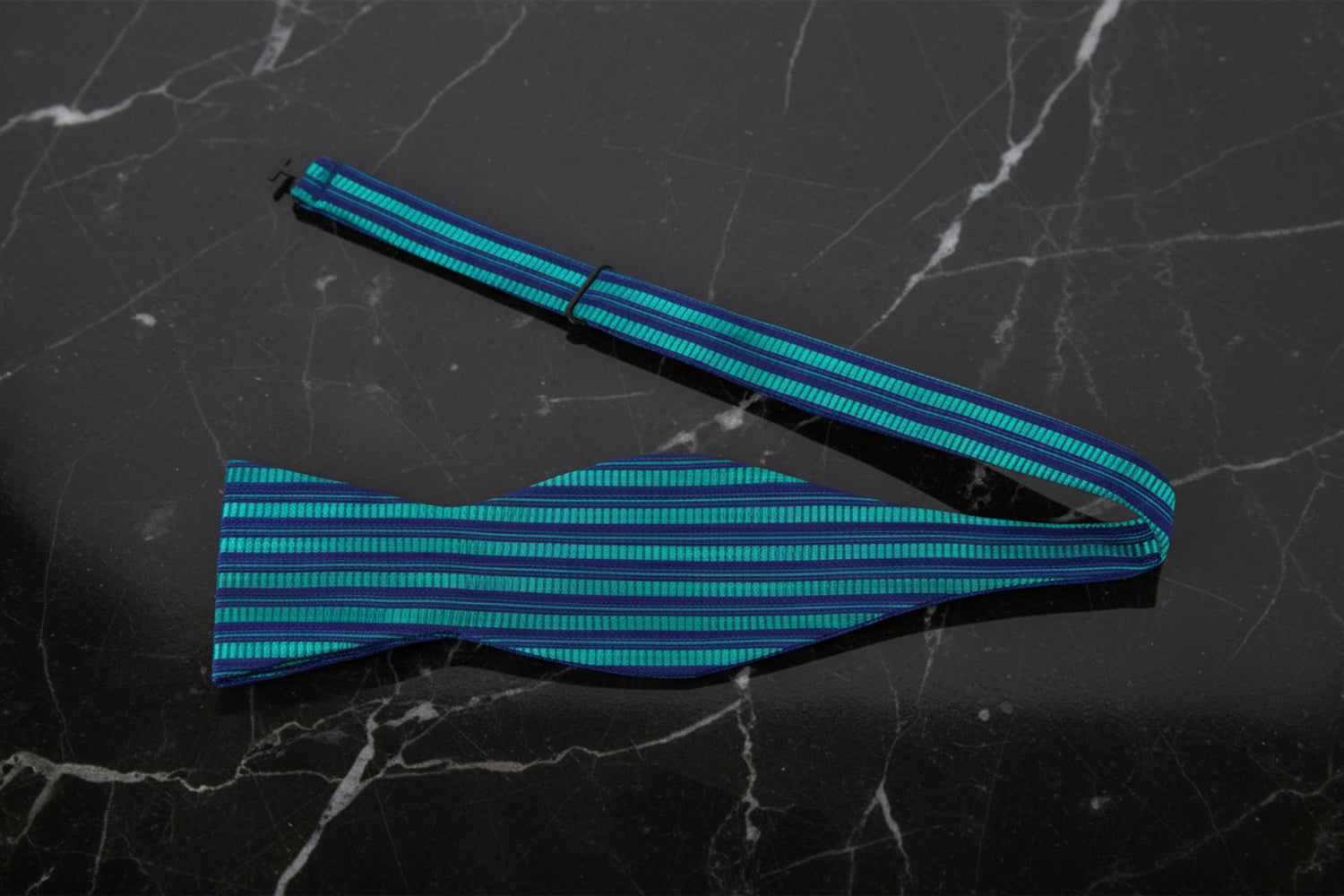 A Green, Blue Stripe Pattern Self Tie Bow Tie Untied
