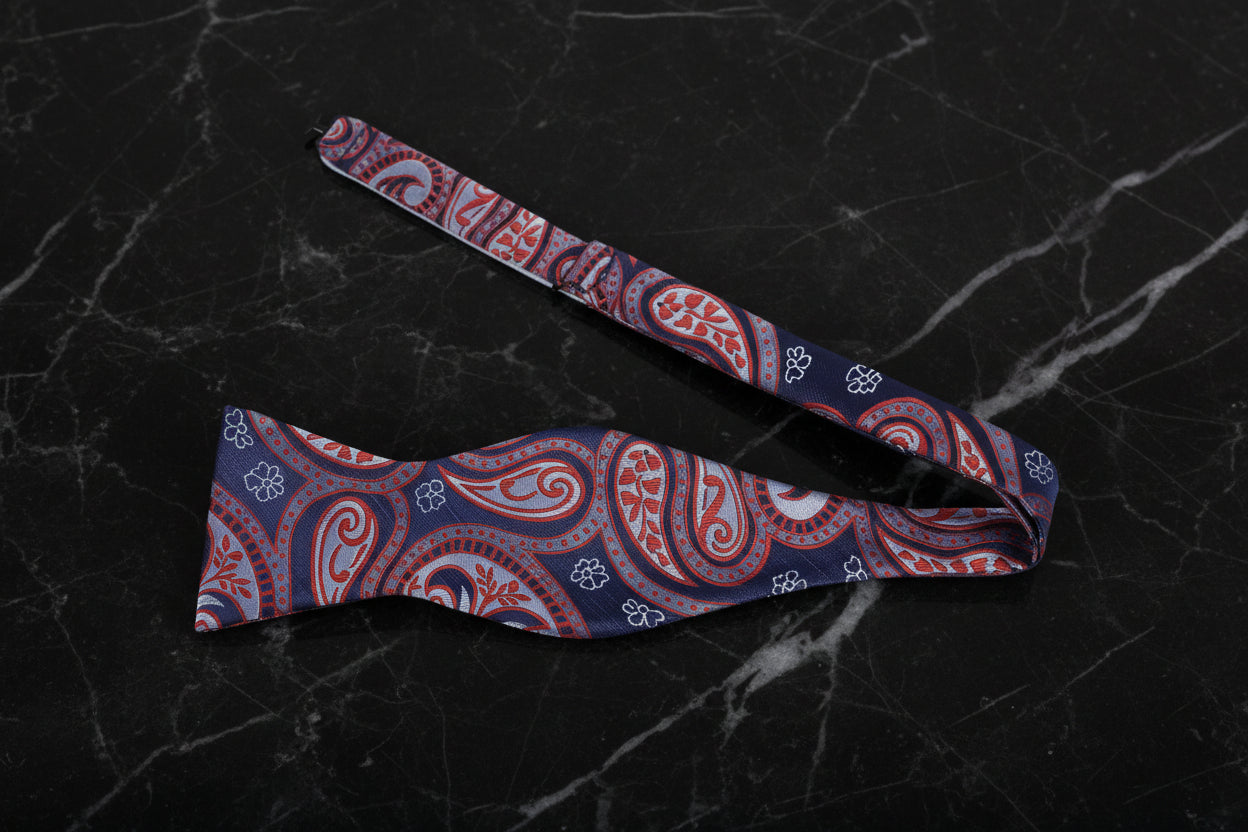 A Red, Blue Paisley Pattern Silk Self Tie Bow Tie Untied