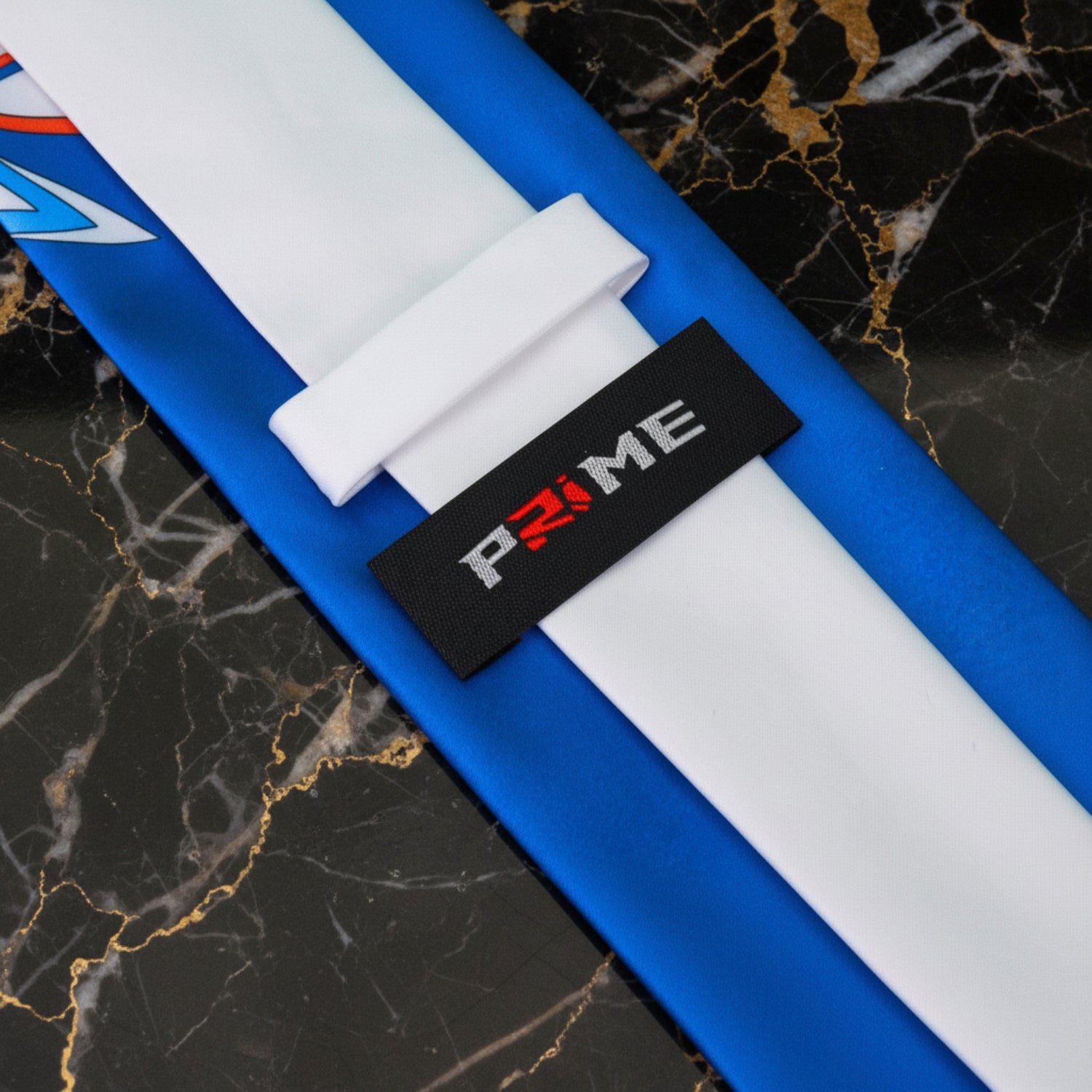 White, Blue, Orange, Yellow Paisley Tie Logo