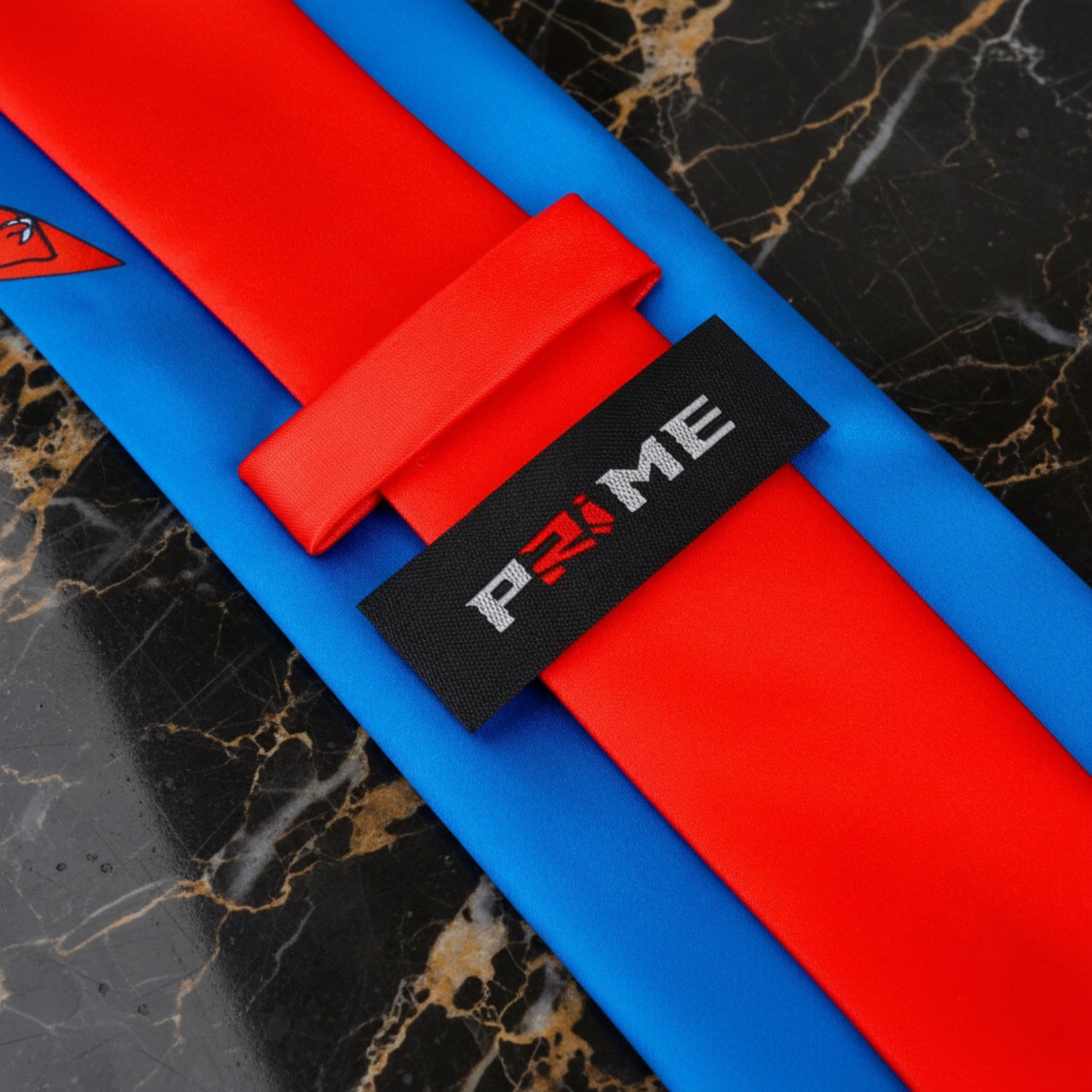 Blue, Red, Orange Paisley Tie Logo