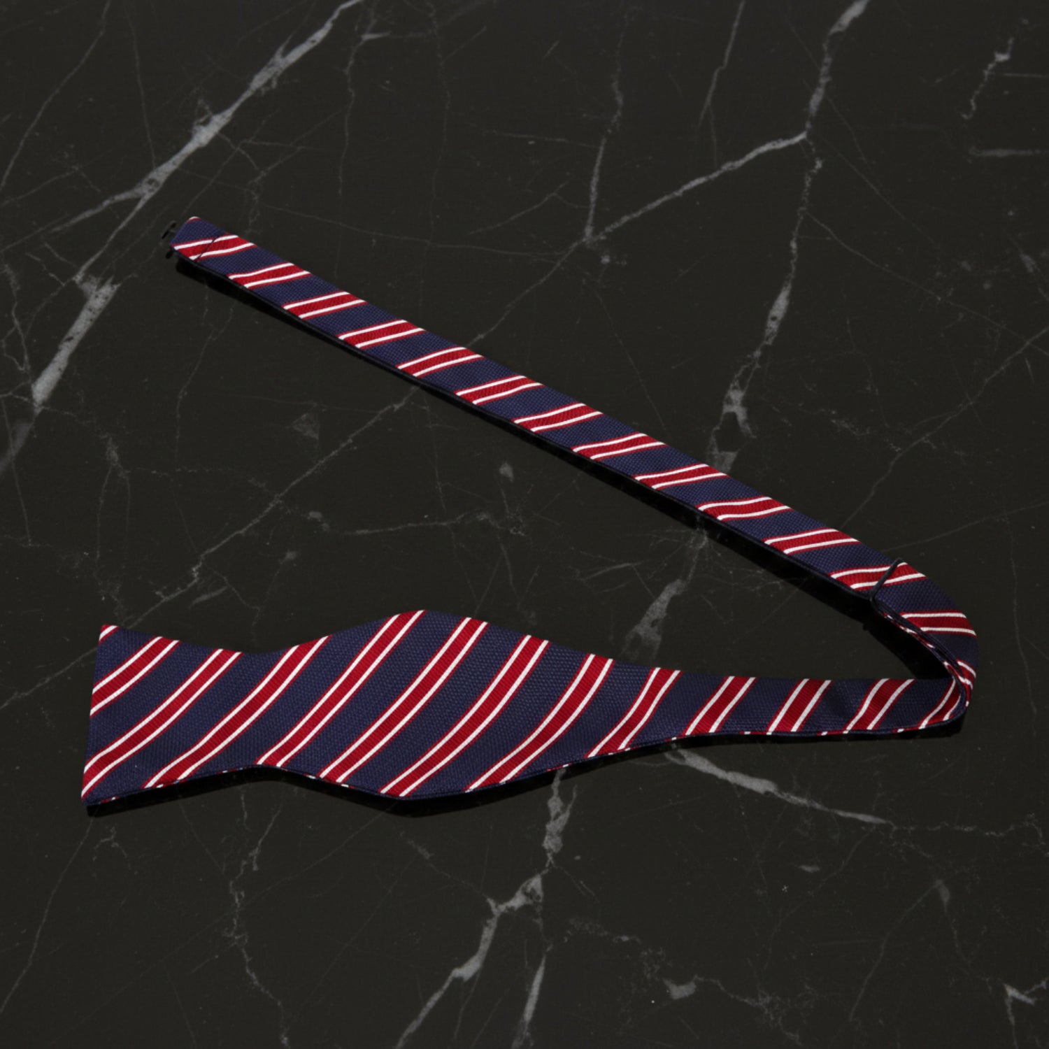 Untied View: A Dark Blue, Red, White Stripe Pattern Self Tie Bow Tie