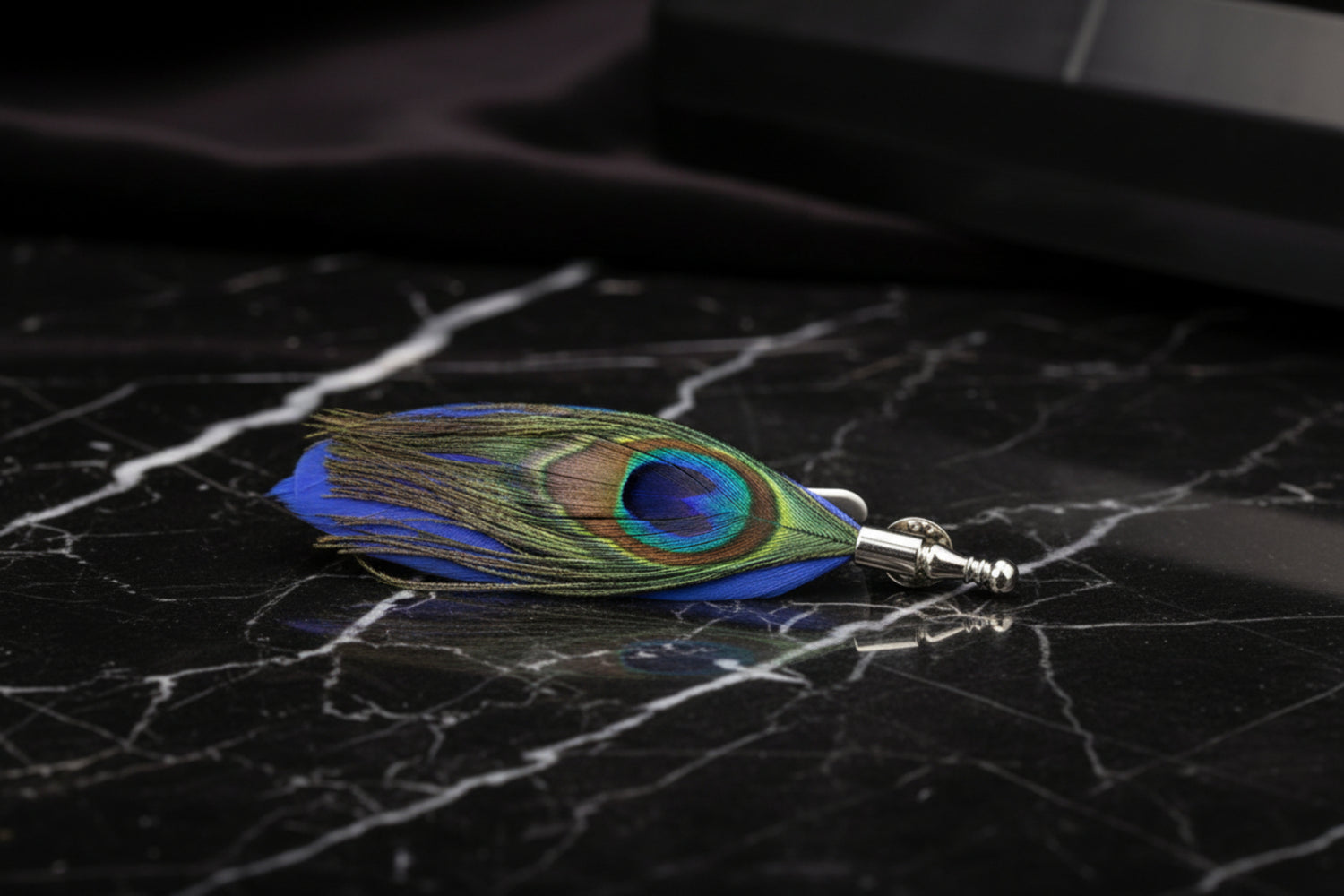 A Blue, Green and Rich Blue Peacock Feather Shaped Lapel Pin